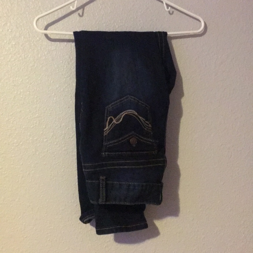 dark wash skinny jeans w/ double button